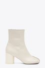 Off white leather ankle boots with anatomic toe and upper stitching 